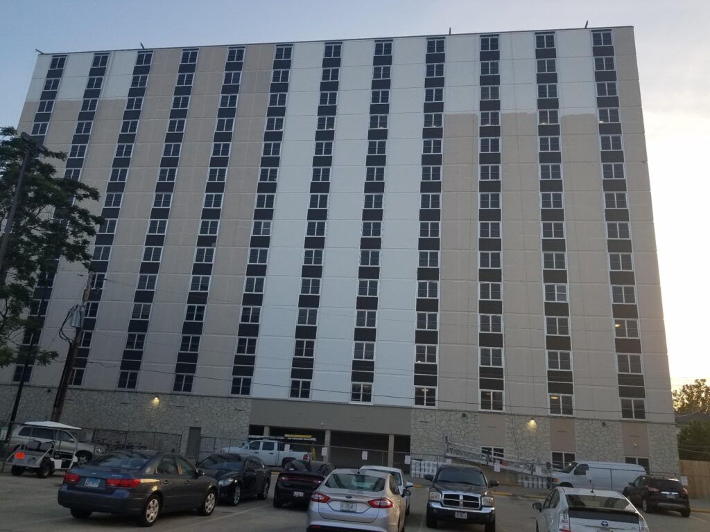 Full façade of a high-rise after commercial exterior painting
