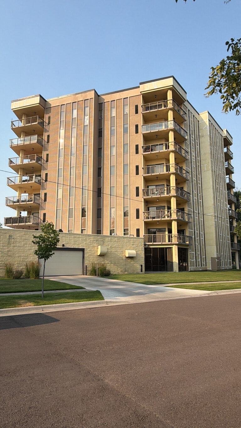 Balcony tower with restored and sealed precast concrete panels after exterior work