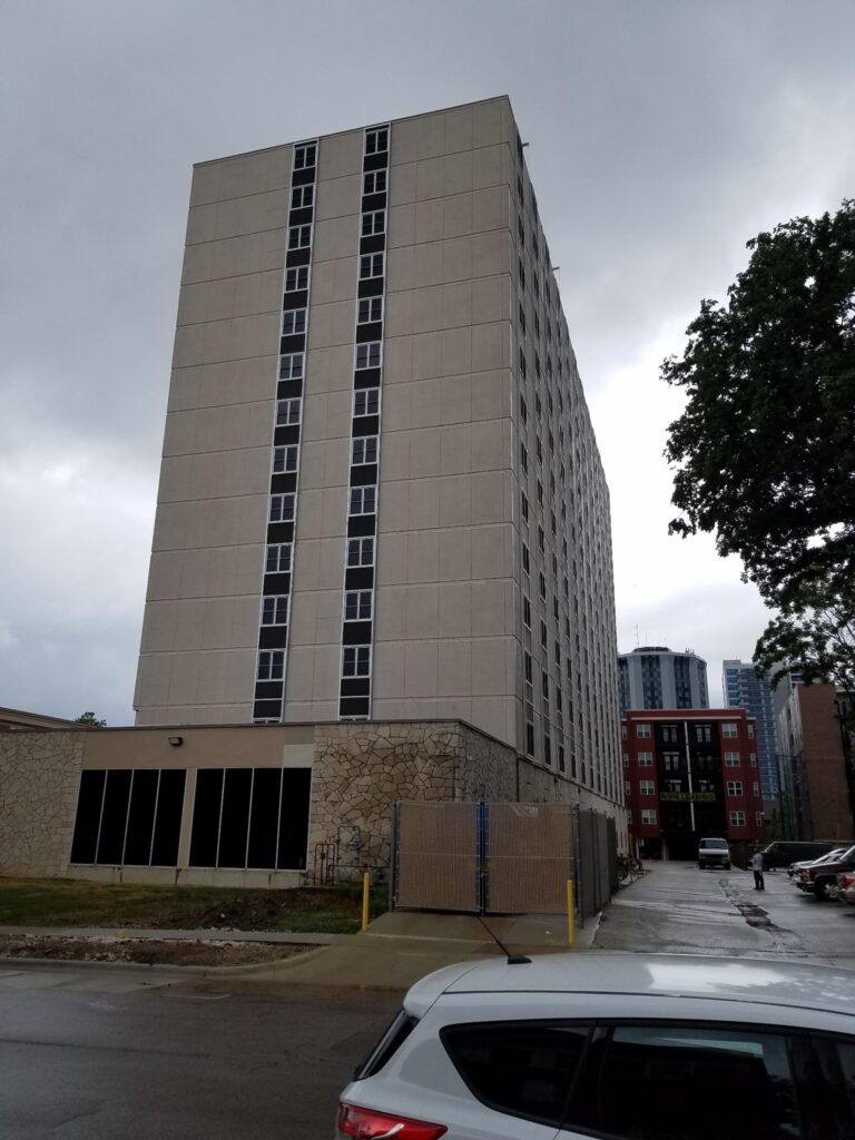 Painted high-rise tower with stacked window columns