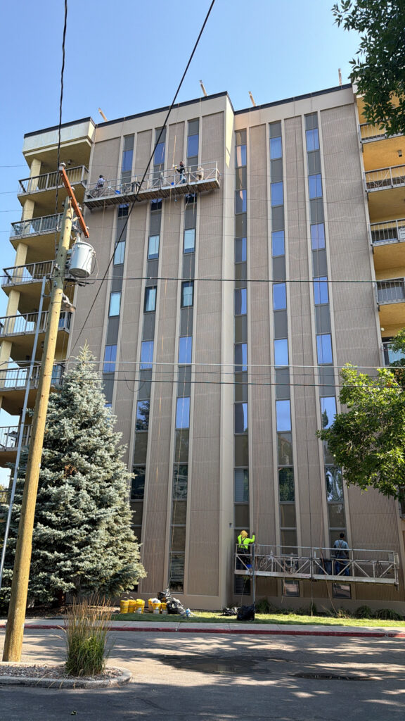Finished precast panels and window perimeters on a high-rise after sealant and coating work