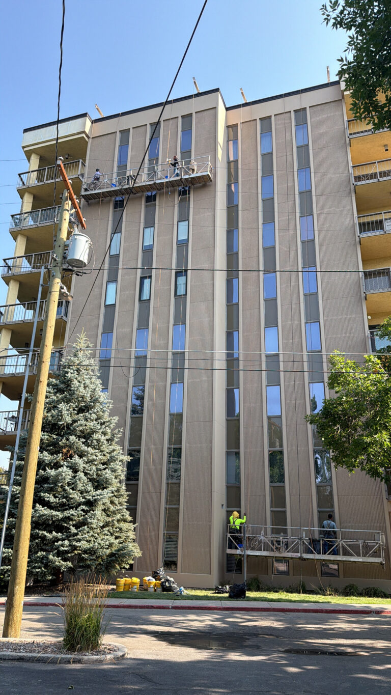 Finished precast panels and window perimeters on a high-rise after sealant and coating work