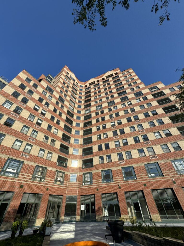 Banded brick façade of a high-rise apartment tower