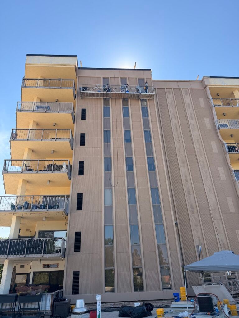 Expansion joint caulking and panel joint work on a high-rise with balconies